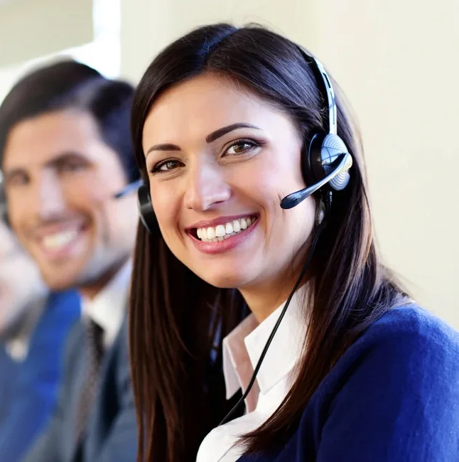 Customer service representatives wearing headsets, smiling and ready to assist in complete chat support.