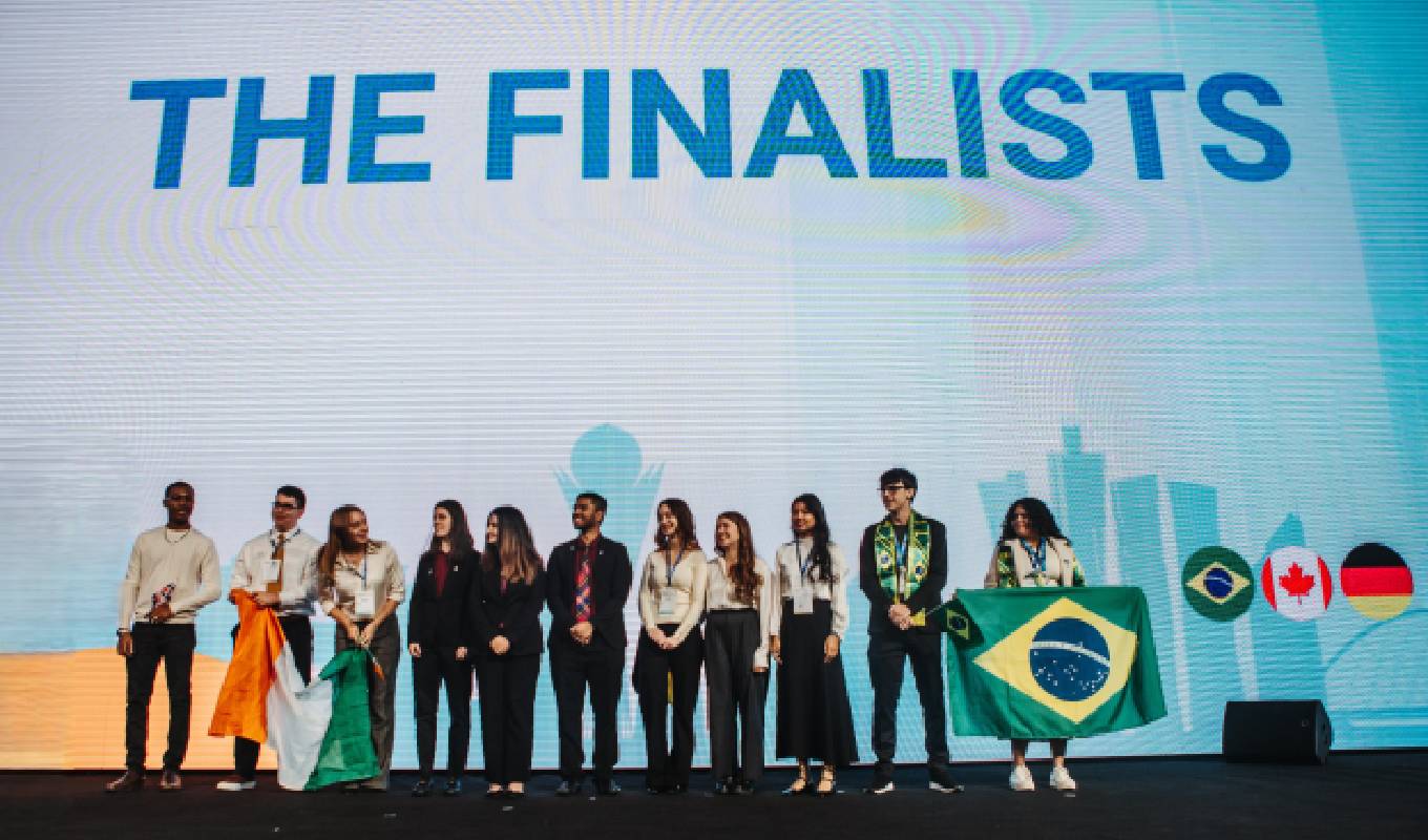 Finalists of the 2024 iTwin4Good Challenge on the competition stage in Kazakhstan. (Image courtesy of Bentley Systems and Enactus)