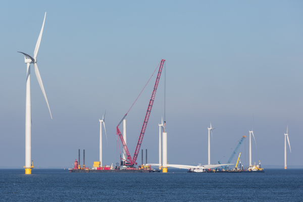 An offshore wind farm under construction with several wind turbines and cranes visible over the water is showcased in the SACS Brochure, which you can conveniently download for more detailed information. | Bentley Systems | Infrastructure Engineering Software Company An offshore wind farm under construction with several wind turbines and cranes visible over the water is showcased in the SACS Brochure, which you can conveniently download for more detailed information.