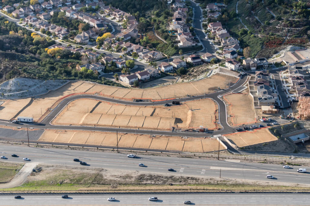 Aerial of view of graded dirt lots ready for new tract home construction in Los Angeles County California